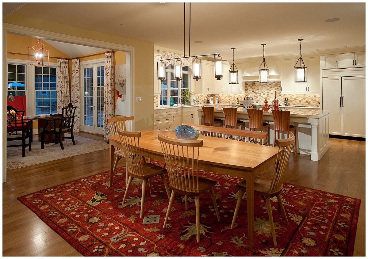 Multiple seats at dining table and breakfast bar in kitchen and dining area.