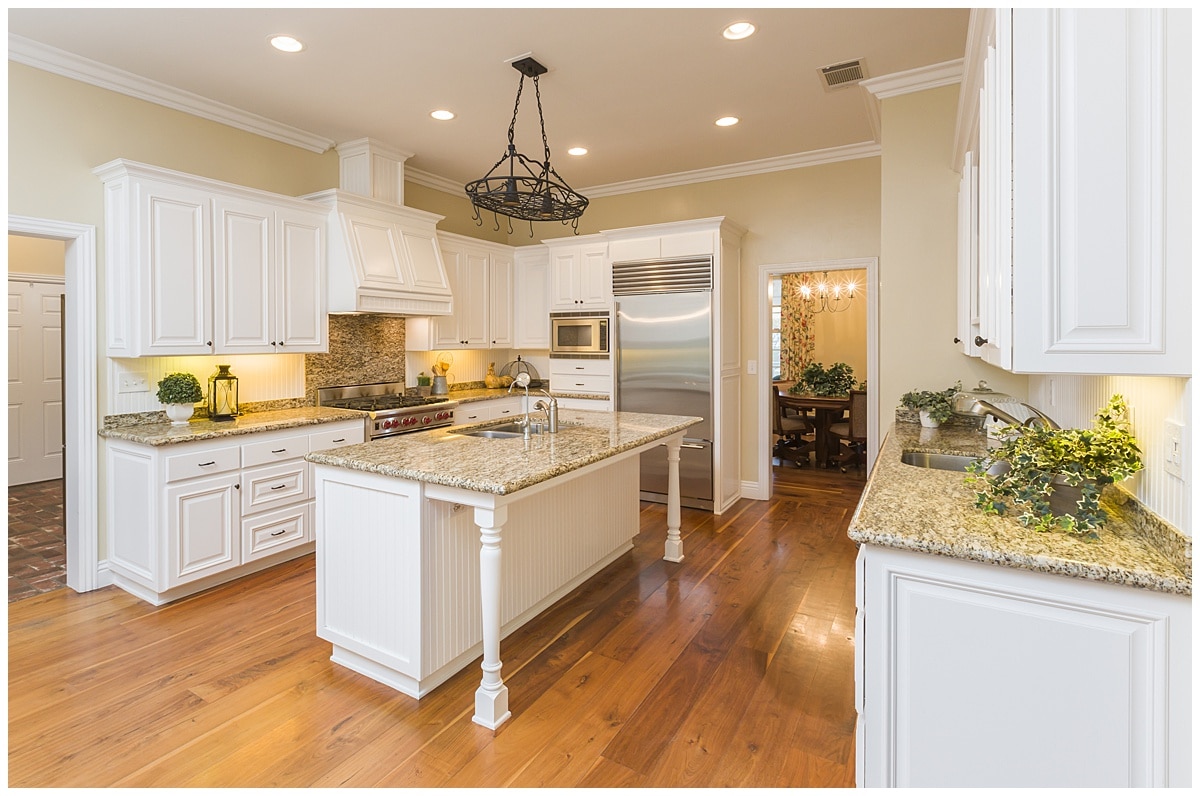 Kitchen island with breakfast bar in center of kitchen