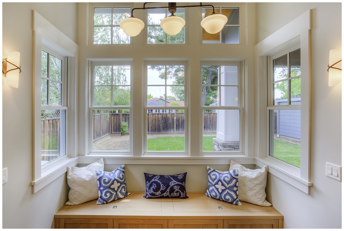 Built-in seating area in front of large windows