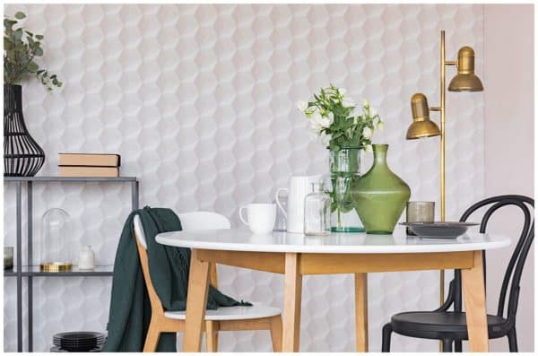 table setting in front of geometric 3d wallpaper