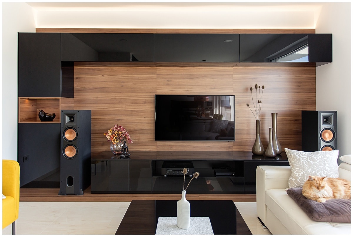 Back cabinets over wooden wall in living room