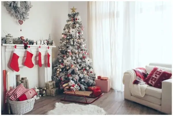 Beautiful holdiay decorated room with Christmas tree with presents under it